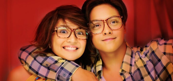 boy and girl in photo booth for she's dating the gangster