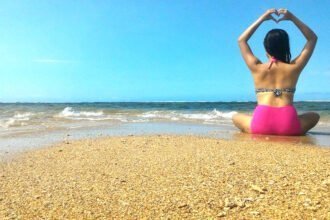 back of a woman in swimsuit in one of the beaches in Misamis Occidental