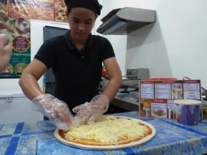 girl making Misamis Occidental best pizza