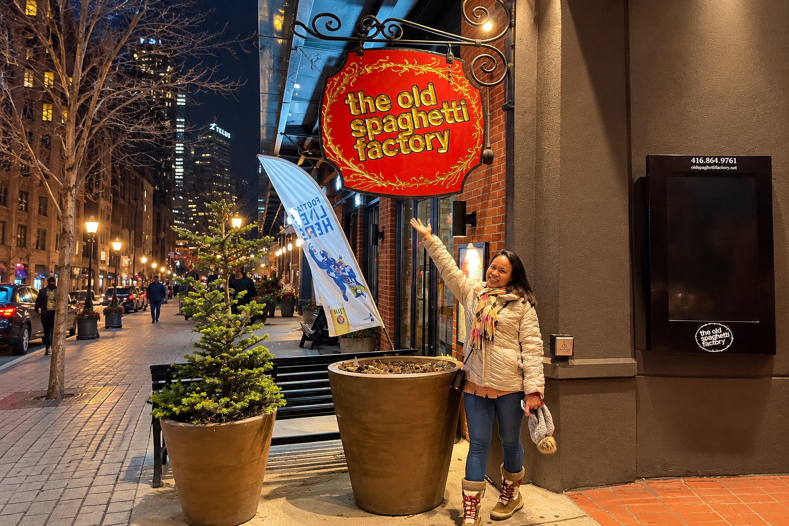 Woman Smiling Beneath the Old Spaghetti Factory Toronto Sign