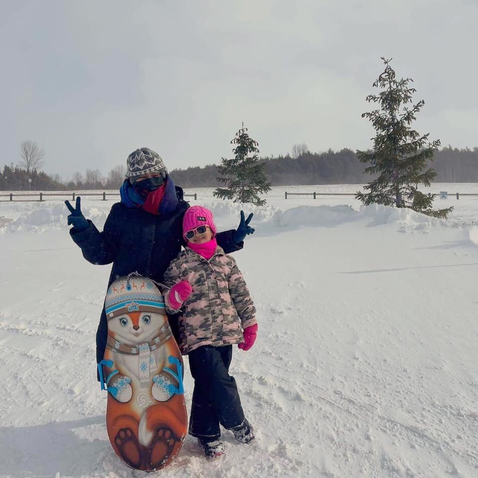 mother and child in ontario tourist attraction winter