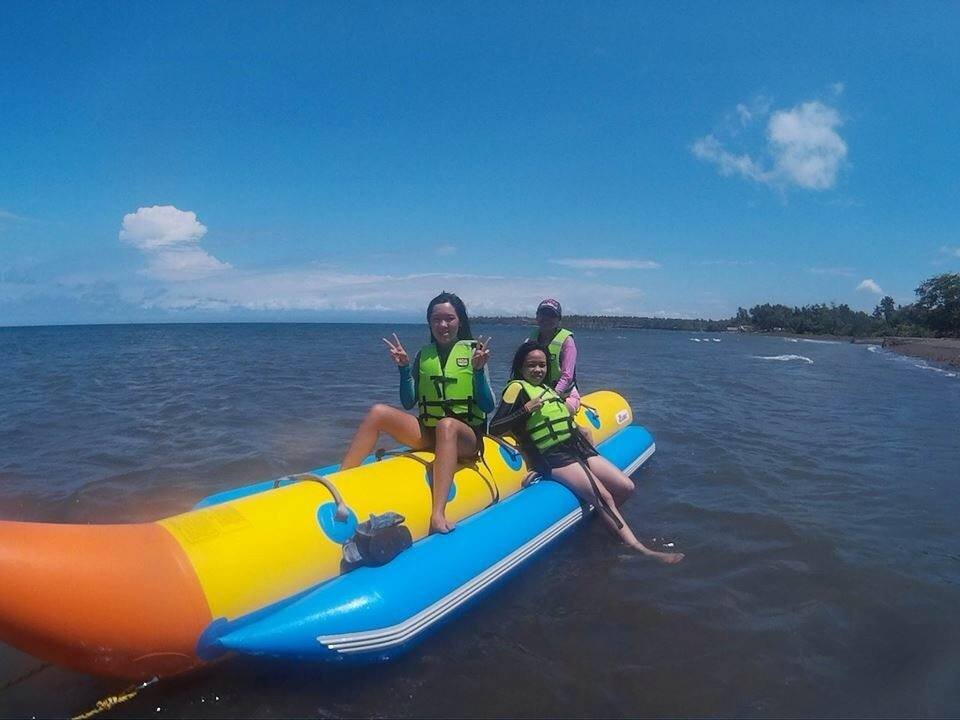 three girls in banana boat at one of the beaches in Misamis Occidental 