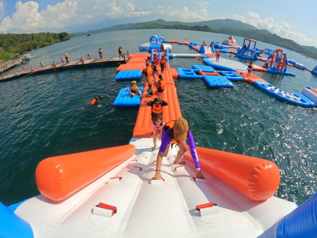 kids playing at floating playground in the beaches in Misamis Occidental