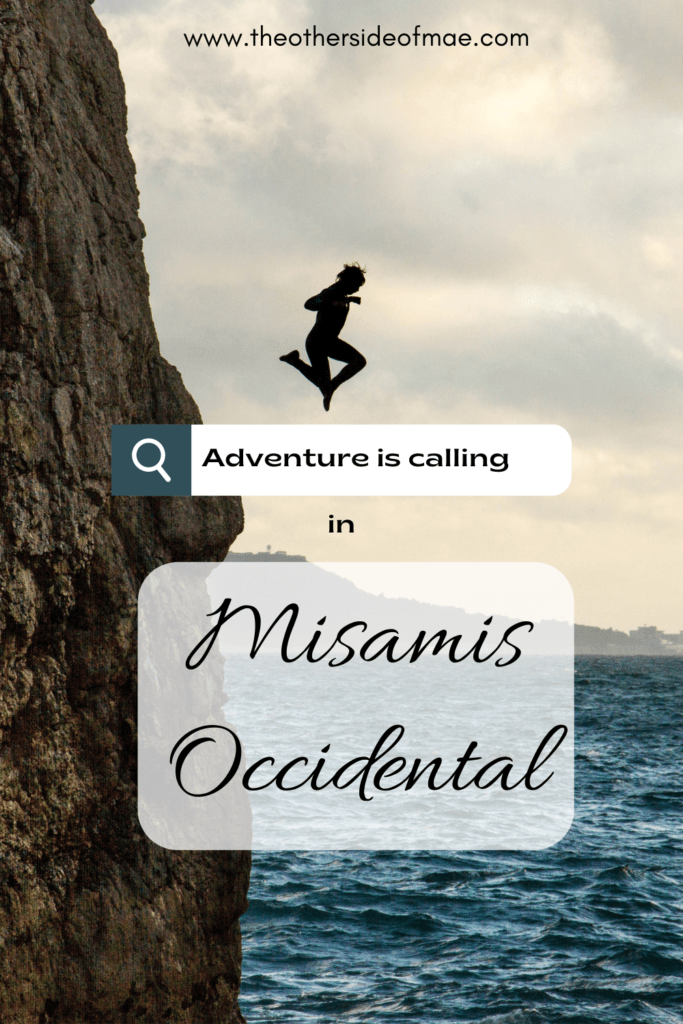 girl diving from a cliff as tourist attraction in Misamis Occidental