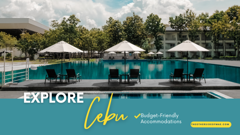 swimming pool with poolside tables, chairs, and umbrellas